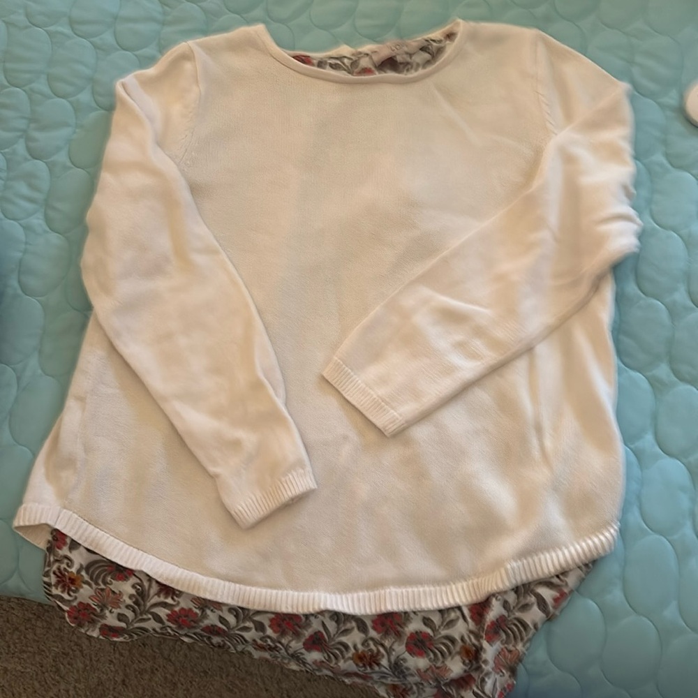 Cream sweater with shirt underlay with 2 ties in the back.